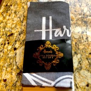 Harrods tea towels set of 2, black with white logo and white with gold logo.